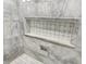 Close up of tiled shower niche with basket weave tile at 12999 Deerstyne Green St, Carmel, IN 46032
