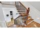 Staircase with wooden treads and decorative iron railing at 12999 Deerstyne Green St, Carmel, IN 46032