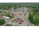 Wide aerial view showcasing commercial buildings, parking lots, and surrounding lush greenery at 1331 S 9Th St, Noblesville, IN 46060