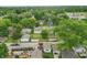 Aerial neighborhood view with tree lined streets, showcasing the arrangement of homes and roads at 1331 S 9Th St, Noblesville, IN 46060