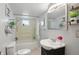 Bathroom features stylish mirror, floral arrangement, and tiled shower at 1331 S 9Th St, Noblesville, IN 46060
