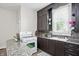 This kitchen features a bright window over the sink and countertop, and a gas range at 1331 S 9Th St, Noblesville, IN 46060