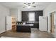 Well-lit kitchen with dark cabinets, functional island, and modern appliances, complemented by ceiling fan at 1331 S 9Th St, Noblesville, IN 46060