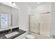 Modern bathroom with a sleek vanity, shower, and fixtures at 1354 Sambar Ct, Greenwood, IN 46143