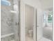 Bathroom featuring a walk-in shower with white marble tile and a view into the water closet and bedroom at 1354 Sambar Ct, Greenwood, IN 46143