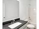 Bright half-bathroom with a shower-tub combo, toilet, and modern fixtures at 1354 Sambar Ct, Greenwood, IN 46143