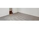 Bedroom featuring neutral carpet flooring, with an open doorway and a view of hardwood floors at 1354 Sambar Ct, Greenwood, IN 46143