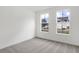 Well-lit bedroom with two windows and plush carpeting at 1354 Sambar Ct, Greenwood, IN 46143