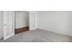 Bright bedroom with plush carpeting and french doors leading to another room at 1354 Sambar Ct, Greenwood, IN 46143