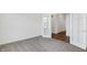 A well lit bedroom with plush carpeting and french doors leading to another room at 1354 Sambar Ct, Greenwood, IN 46143