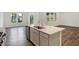 Spacious kitchen island with a sink and quartz countertop, offering ample space for food preparation and entertaining at 1354 Sambar Ct, Greenwood, IN 46143