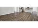 A contemporary kitchen boasts stainless steel appliances and a functional island with wood floors throughout the space at 1354 Sambar Ct, Greenwood, IN 46143