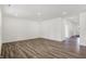 An open-concept room with recessed lighting and wood floors throughout, with clear views into other rooms at 1354 Sambar Ct, Greenwood, IN 46143
