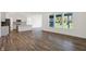 Open-concept living area featuring stainless steel appliances, wood flooring and views of the outdoors at 1354 Sambar Ct, Greenwood, IN 46143