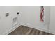 Utility room shows hardwood floors, new connection boxes and circuit panel at 1354 Sambar Ct, Greenwood, IN 46143