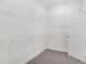 Walk-in closet featuring built-in wire shelving and plush carpeting at 1354 Sambar Ct, Greenwood, IN 46143