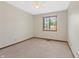 Cozy bedroom with neutral carpet, a ceiling fan and a bright window overlooking the outdoor scenery at 150 Dominion Dr, Zionsville, IN 46077