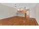Charming dining room area boasting hardwood floors and stylish chandelier lighting over an open-concept space at 150 Dominion Dr, Zionsville, IN 46077