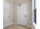 Inviting foyer with neutral tile flooring, a large coat closet, and access to natural light through a window at 150 Dominion Dr, Zionsville, IN 46077