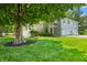 Well-manicured lawn and mature trees provide shade and privacy for this lovely townhouse with a two-car garage at 150 Dominion Dr, Zionsville, IN 46077