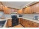 A functional kitchen equipped with modern appliances, ample wood cabinets, and a bright, clean design at 150 Dominion Dr, Zionsville, IN 46077