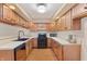 Well-lit kitchen featuring wood cabinetry, modern appliances, and a functional layout for cooking and entertaining at 150 Dominion Dr, Zionsville, IN 46077