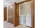 A handy laundry room is located just off the hallway with a door to hide the machines at 150 Dominion Dr, Zionsville, IN 46077