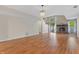 Inviting living area with wood floors, brick fireplace, and staircase to the upper level and natural light at 150 Dominion Dr, Zionsville, IN 46077