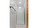 Bathroom featuring a shower with textured glass, silver trim, and a towel bar at 150 Dominion Dr, Zionsville, IN 46077
