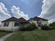 Spacious home boasts professionally landscaped yard, green shutters, brick walkway, and large green lawn at 1809 Milford St, Carmel, IN 46032