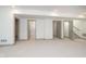 Spacious carpeted basement area with multiple doorways leading to other rooms in the home at 1818 Central Ave, Indianapolis, IN 46202