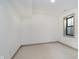 This bedroom offers neutral carpeting and a single window framed in dark trim at 1818 Central Ave, Indianapolis, IN 46202