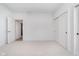 Bright bedroom features neutral carpet, a closet with sliding doors, and an ensuite entrance at 1822 Central Ave, Indianapolis, IN 46202