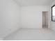 Neutral bedroom with carpet, an open closet, base trim, and a window at 1822 Central Ave, Indianapolis, IN 46202