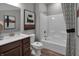 Bathroom featuring a modern vanity with framed mirror, a white toilet, and a shower-tub combination with stylish curtain at 19348 Mcbee Ave, Westfield, IN 46074