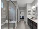 Long bathroom featuring a glass enclosed shower, double vanity, and decor at 19348 Mcbee Ave, Westfield, IN 46074