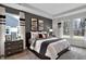 This primary bedroom features large bright windows, soft carpet, modern furniture and stylish decor at 19348 Mcbee Ave, Westfield, IN 46074