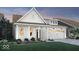 Charming single-Gathering home showcasing white siding, black accents, well-manicured lawn, and a welcoming two-car garage at 19348 Mcbee Ave, Westfield, IN 46074