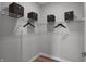 Bright walk-in closet with white wire shelving and black storage boxes, providing ample and organized storage space at 19348 Mcbee Ave, Westfield, IN 46074