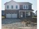 Two story home with a two car garage, covered porch and stone and vinyl siding at 2145 Boxwood Dr, Greenfield, IN 46140