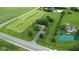 Spacious lot featuring lush green space, charming brick home, pond, and inground pool at 22620 Lamong Rd, Sheridan, IN 46069