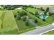 Large lot with a charming brick home, pond, inground pool, and lush green space at 22620 Lamong Rd, Sheridan, IN 46069