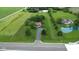 Spacious lot featuring lush green space, charming brick home, pond, and inground pool at 22620 Lamong Rd, Sheridan, IN 46069