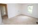 A light-filled bedroom features neutral carpet, double closet, and access to other rooms at 22620 Lamong Rd, Sheridan, IN 46069