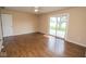 Bedroom featuring hard surface floors, a door to backyard, and neutral walls at 22620 Lamong Rd, Sheridan, IN 46069
