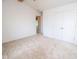 Light-filled carpeted bedroom with vaulted ceilings, double closet and a view of an open doorway at 22620 Lamong Rd, Sheridan, IN 46069