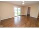 Bedroom with wood floors, a ceiling fan, and sliding glass door to backyard at 22620 Lamong Rd, Sheridan, IN 46069