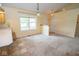 Bright dining area with carpet, large window, and neutral paint, adjacent to the kitchen at 22620 Lamong Rd, Sheridan, IN 46069
