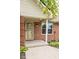 Charming brick home featuring a decorative glass front door and covered entryway at 22620 Lamong Rd, Sheridan, IN 46069