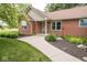 Charming brick home with manicured front yard, walkway, and attractive landscaping at 22620 Lamong Rd, Sheridan, IN 46069